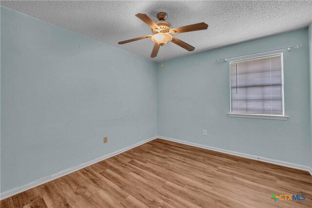 1123 Rhonda Lee St, Copperas Cove, TX 76522 - unfurnished room with wood finished floors, ceiling fan, a textured ceiling, and baseboards