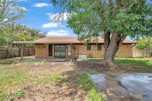 1123 Rhonda Lee St, Copperas Cove, TX 76522 - back of property with a patio area, central AC, and brick siding