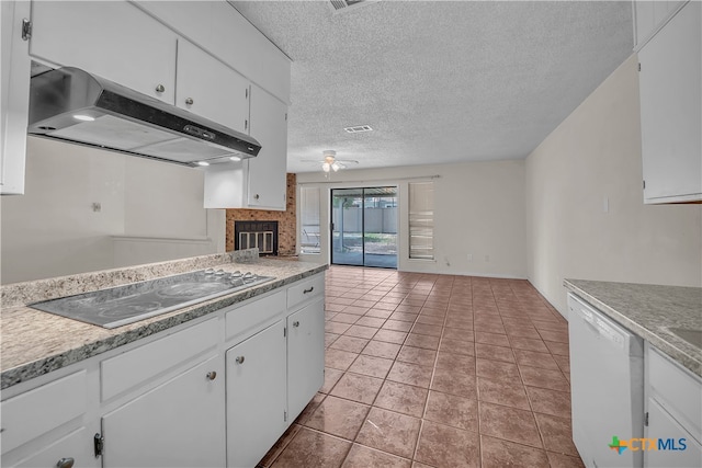 kitchen featuring white cabinets, a fireplace, black electric stovetop, and white dishwasher