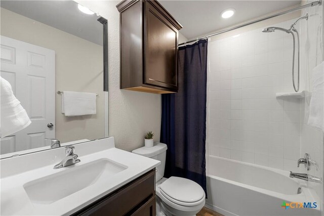 1313 Juneberry Park Dr, Temple, TX 76502 - bathroom with toilet, vanity, shower / tub combo with curtain, and recessed lighting