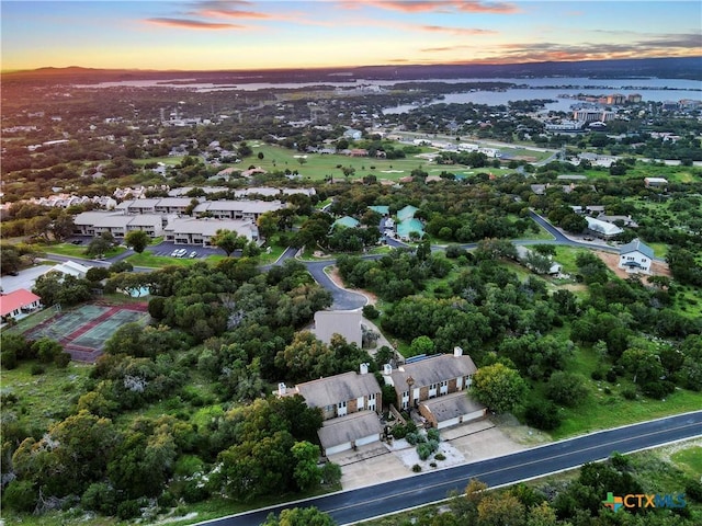 aerial view at dusk with a water view