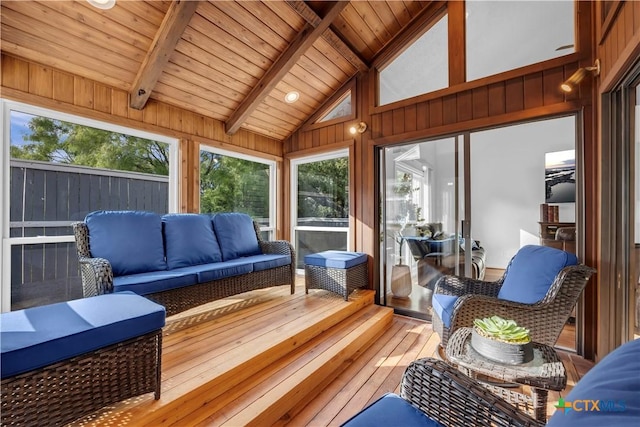 sunroom featuring lofted ceiling with beams and wood ceiling