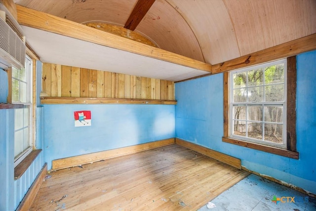 948 Sycamore St, San Marcos, TX 78666 - unfurnished room featuring vaulted ceiling, wood finished floors, and baseboards