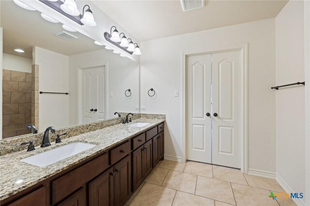215 Maverick Cir, Horseshoe Bay, TX 78657 - full bathroom featuring double vanity and tile patterned flooring
