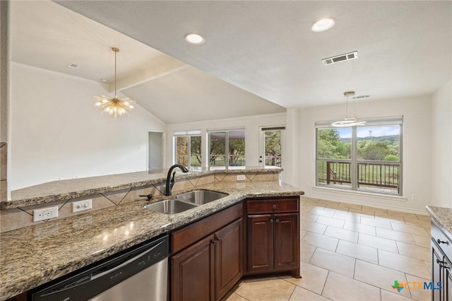 215 Maverick Cir, Horseshoe Bay, TX 78657 - kitchen featuring dishwasher, light stone countertops, light tile patterned floors, hanging light fixtures, and recessed lighting
