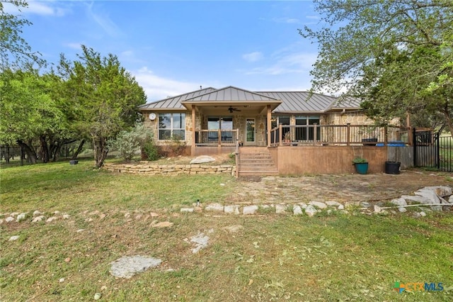 215 Maverick Cir, Horseshoe Bay, TX 78657 - rear view of house featuring a standing seam roof, a ceiling fan, a lawn, and a porch