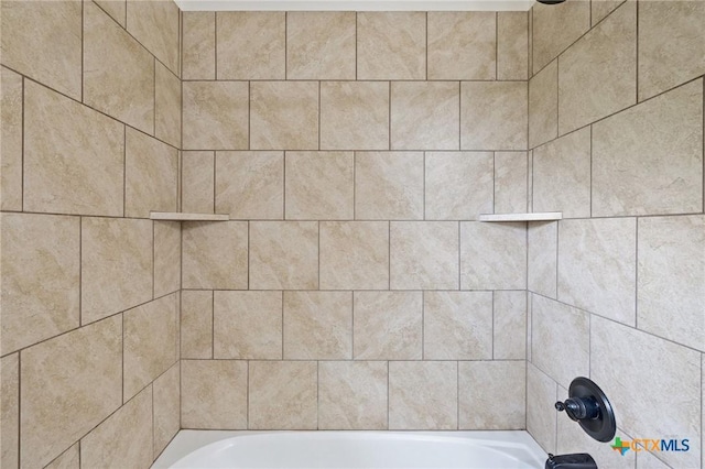 215 Maverick Cir, Horseshoe Bay, TX 78657 - full bathroom featuring washtub / shower combination