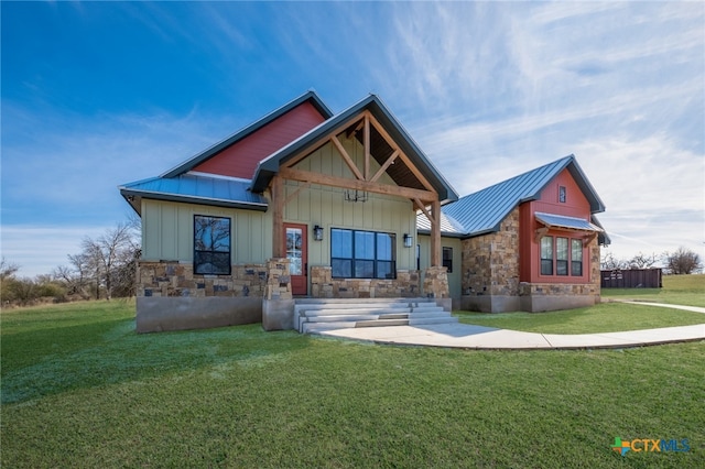 56 Powder Rdg, Luling, TX 78648 - craftsman house with stone siding, board and batten siding, a front lawn, and a metal roof
