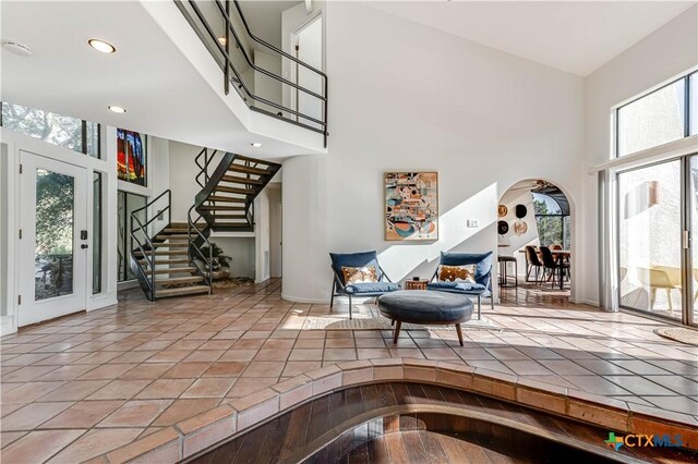 2701 Hillside Cir, New Braunfels, TX 78132 - entrance foyer with a towering ceiling, stairs, arched walkways, and recessed lighting
