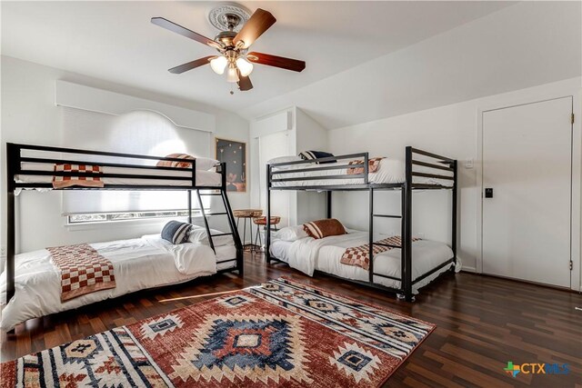 2701 Hillside Cir, New Braunfels, TX 78132 - bedroom featuring wood finished floors, vaulted ceiling, and a ceiling fan