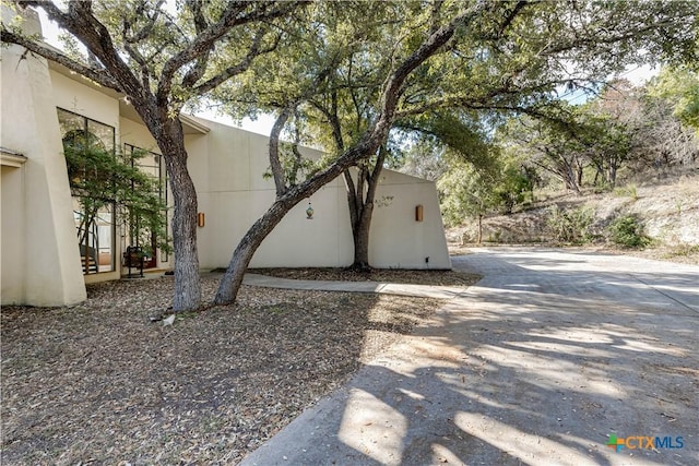 exterior space featuring stucco siding