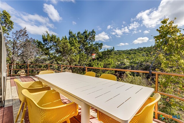 wooden deck featuring outdoor dining space