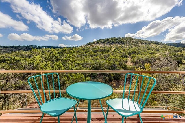 2701 Hillside Cir, New Braunfels, TX 78132 - balcony featuring a forest view