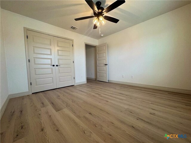 1806 Gigante Dr, Killeen, TX 76543 - unfurnished bedroom featuring light wood-style flooring, baseboards, and a closet