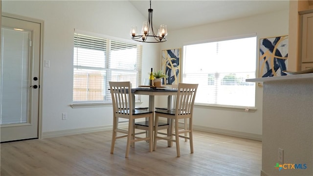 1806 Gigante Dr, Killeen, TX 76543 - dining space featuring a chandelier, light wood-style floors, baseboards, and lofted ceiling