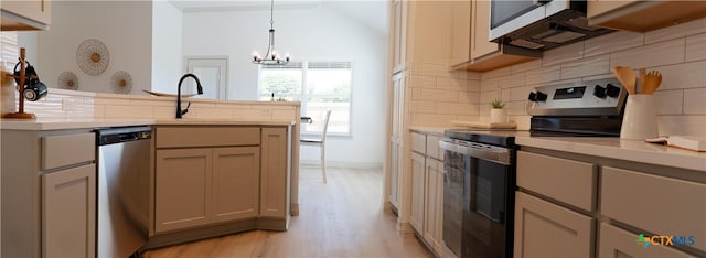 1806 Gigante Dr, Killeen, TX 76543 - kitchen with stainless steel appliances, backsplash, light countertops, light wood-style flooring, and a chandelier