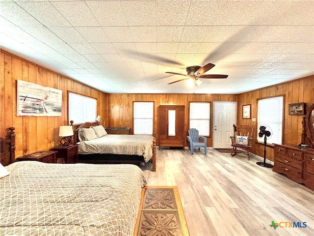 bedroom with hardwood / wood-style floors and ceiling fan