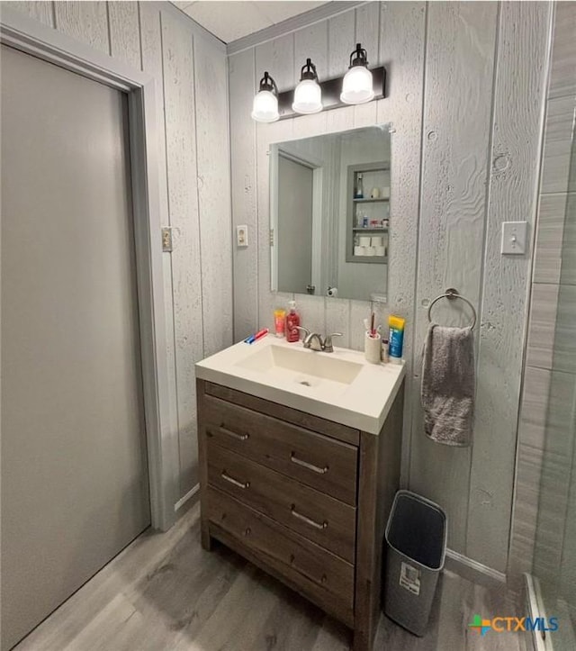 bathroom with vanity and wood-type flooring