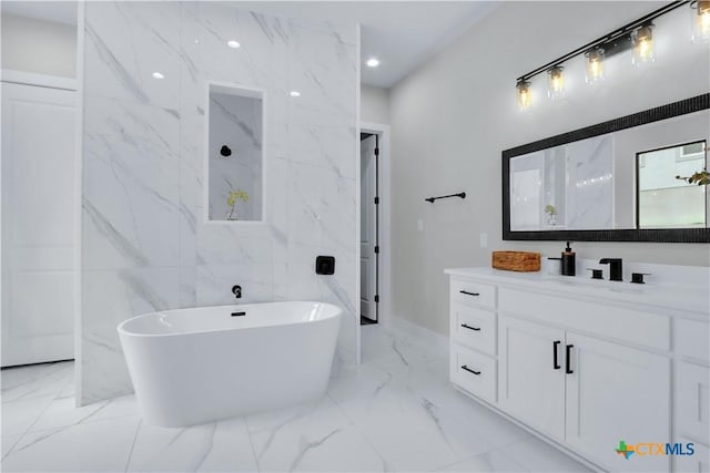 bathroom with vanity and a bathtub