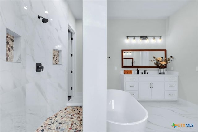 bathroom featuring vanity and separate shower and tub