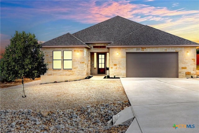 view of front of property with a garage