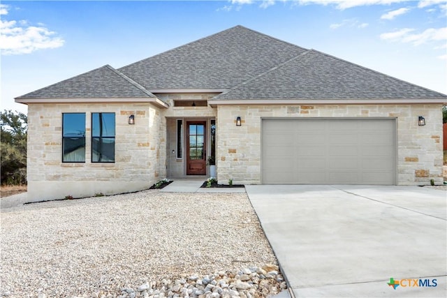 view of front of home with a garage