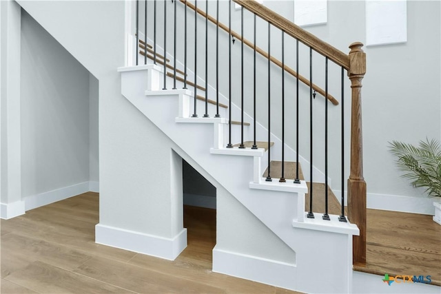 staircase featuring hardwood / wood-style flooring