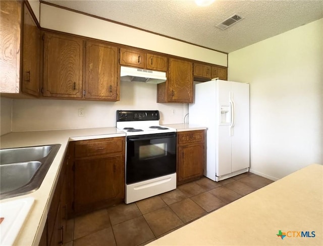 1804 Kingman Rd, Killeen, TX 76549 - kitchen with range with electric cooktop, under cabinet range hood, white fridge with ice dispenser, light countertops, and a textured ceiling