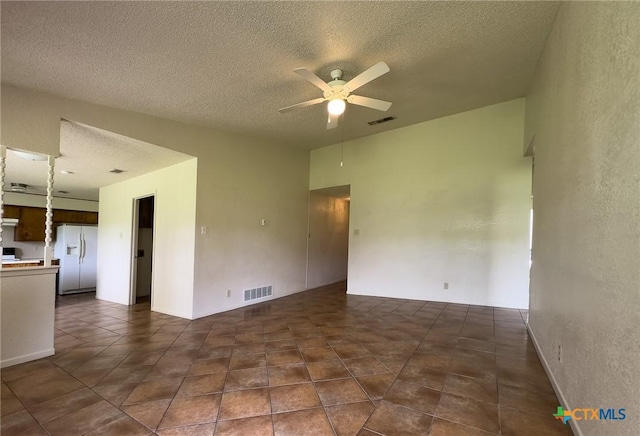 1804 Kingman Rd, Killeen, TX 76549 - empty room featuring ceiling fan, a textured ceiling, and dark tile patterned flooring