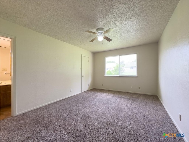 1804 Kingman Rd, Killeen, TX 76549 - unfurnished bedroom with carpet flooring, a textured ceiling, ceiling fan, and ensuite bath