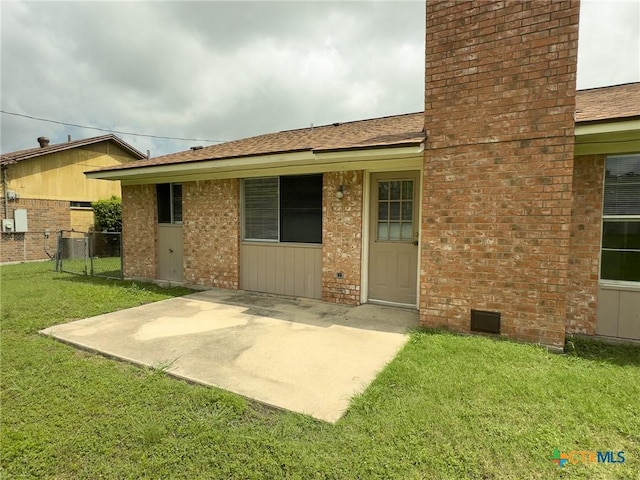 1804 Kingman Rd, Killeen, TX 76549 - back of house featuring a patio area, brick siding, a chimney, and a shingled roof