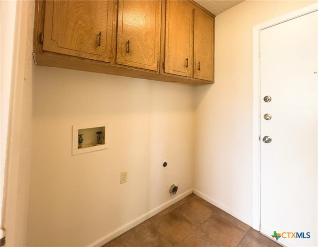 1804 Kingman Rd, Killeen, TX 76549 - laundry room featuring cabinet space, hookup for a washing machine, electric dryer hookup, and tile patterned floors