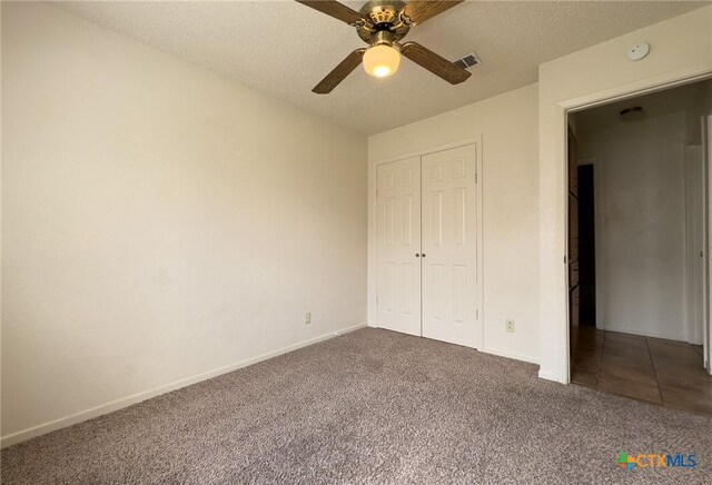 1804 Kingman Rd, Killeen, TX 76549 - unfurnished bedroom with carpet floors, a closet, a ceiling fan, and a textured ceiling