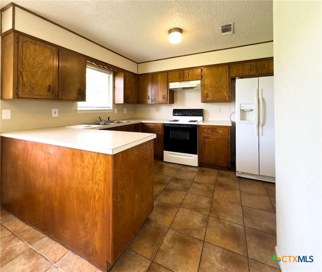 1804 Kingman Rd, Killeen, TX 76549 - kitchen with white appliances, under cabinet range hood, a peninsula, light countertops, and a textured ceiling