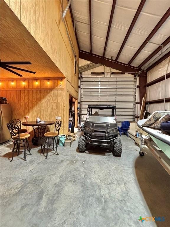 garage with stainless steel refrigerator