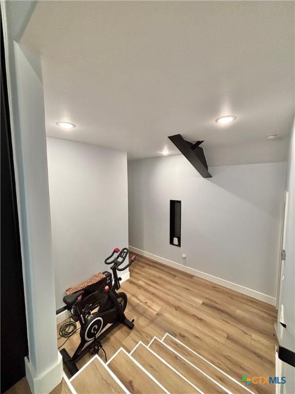 exercise area featuring hardwood / wood-style floors