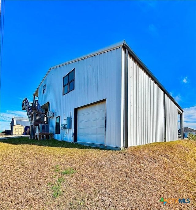 garage with a yard