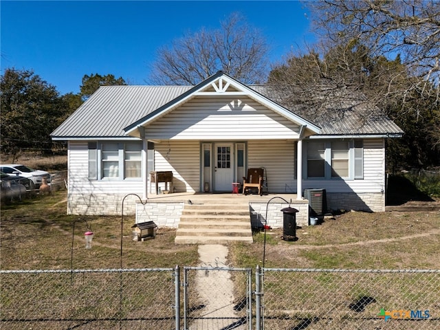 bungalow with a porch and a front lawn