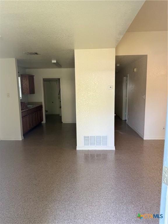705 N 2nd St, Temple, TX 76501 - unfurnished room featuring baseboards and a textured ceiling