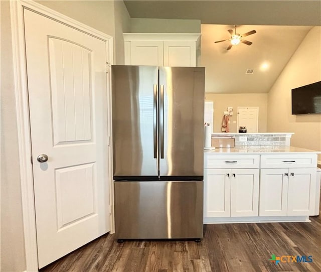 109 Opal Way, Port Lavaca, TX 77979 - kitchen with freestanding refrigerator, ceiling fan, dark wood-style flooring, white cabinets, and vaulted ceiling
