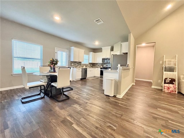 109 Opal Way, Port Lavaca, TX 77979 - kitchen featuring stainless steel appliances, dark wood finished floors, white cabinets, backsplash, and baseboards
