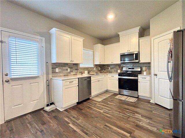 109 Opal Way, Port Lavaca, TX 77979 - kitchen featuring stainless steel appliances, backsplash, and white cabinetry