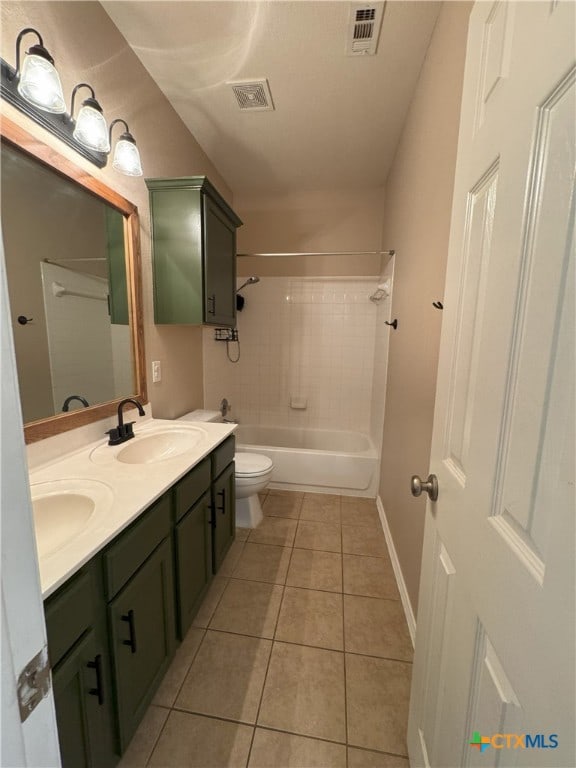 full bathroom with vanity, toilet, tile patterned floors, and tiled shower / bath