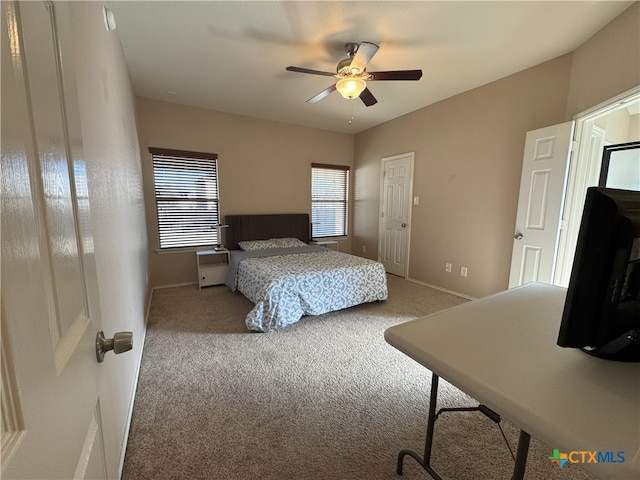 carpeted bedroom featuring ceiling fan