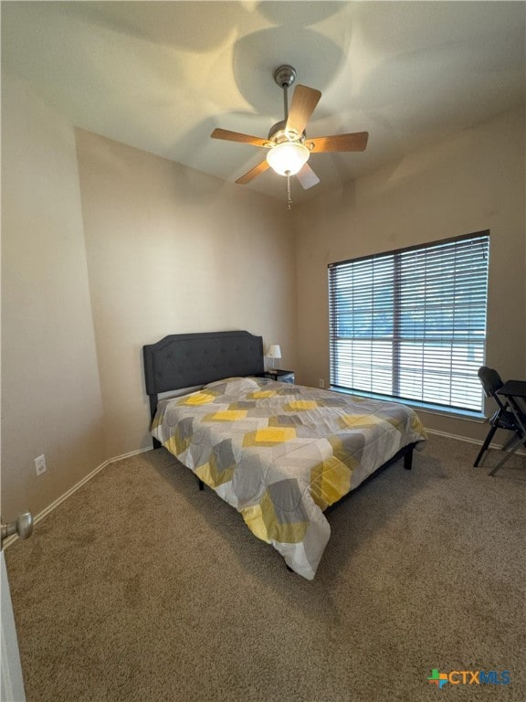 bedroom with ceiling fan and carpet