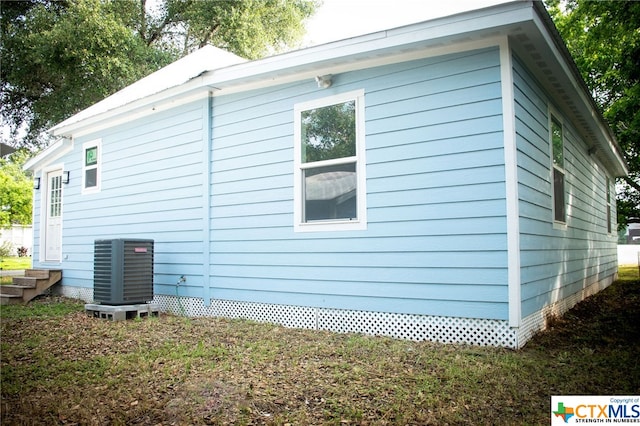 view of side of property with cooling unit