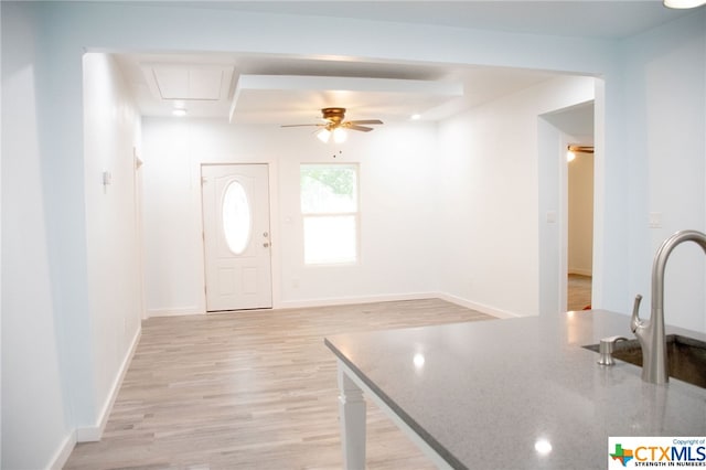 entrance foyer featuring ceiling fan and light hardwood / wood-style floors