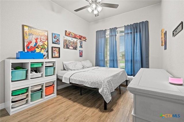 900 Holliday Dr, Killeen, TX 76542 - bedroom featuring light wood-style floors, ceiling fan, and baseboards
