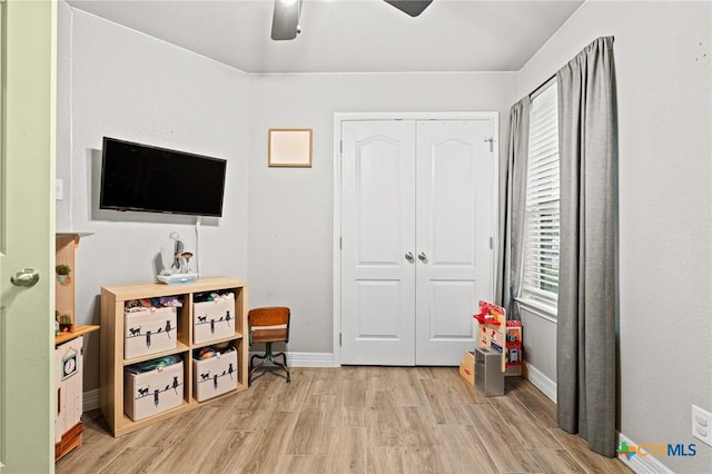 900 Holliday Dr, Killeen, TX 76542 - playroom featuring light wood finished floors, baseboards, and a ceiling fan
