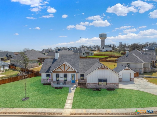 view of front of house with a front lawn, a residential view, and a shingled roof